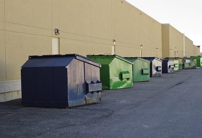 a row of heavy-duty dumpsters ready for use at a construction project in Alvarado